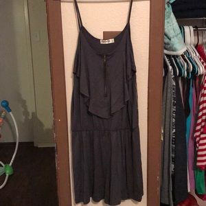 Grey spaghetti strap romper with zipper.