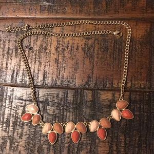 Trendy gold necklace with neutral gems