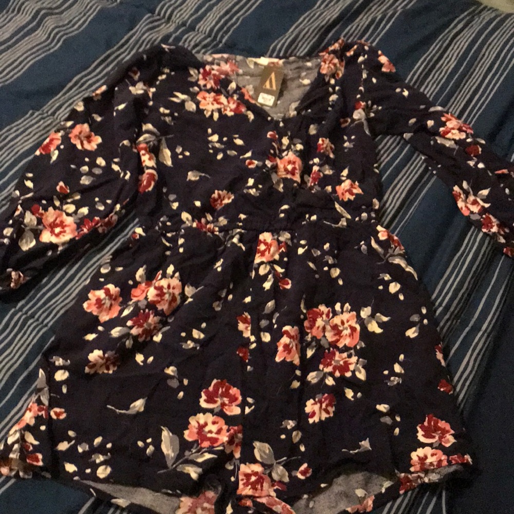 Navy blue floral romper. New with tags!
