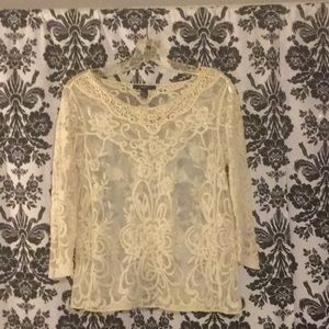 Sheer cream-colored blouse