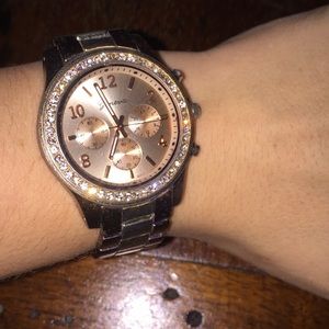 Rose gold watch with diamonds around the face