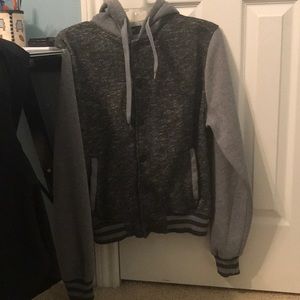Gray varsity jacket.