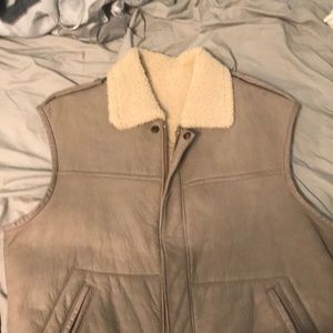 Sleeveless vest jacket with soft fabric interior.