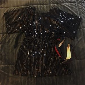 Black sequin mini dress with open back