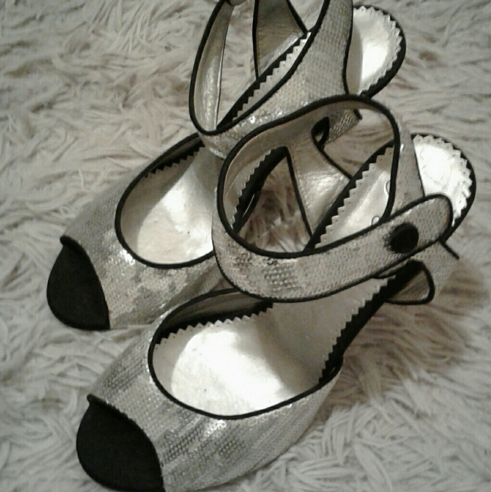 Black and silver glitter high heels .