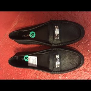 Black flat coach shoes. New. Never worn