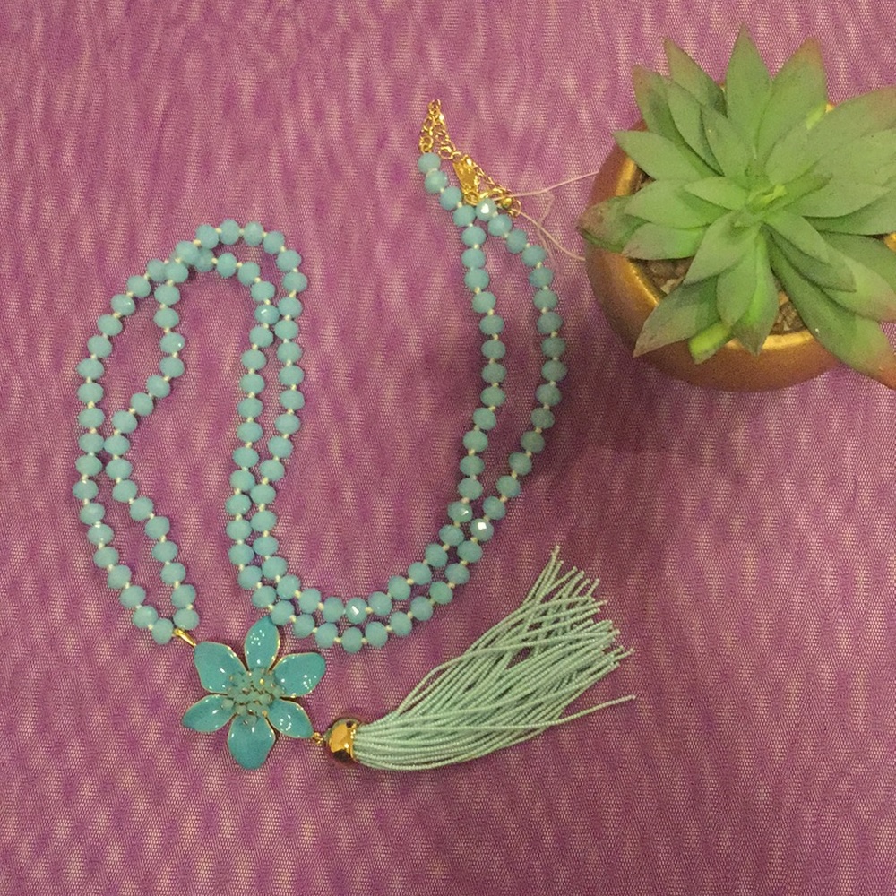 Kate Spade light blue necklace with flower tussle