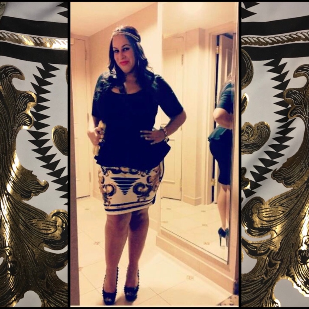 White, gold, and black knee length skirt.
