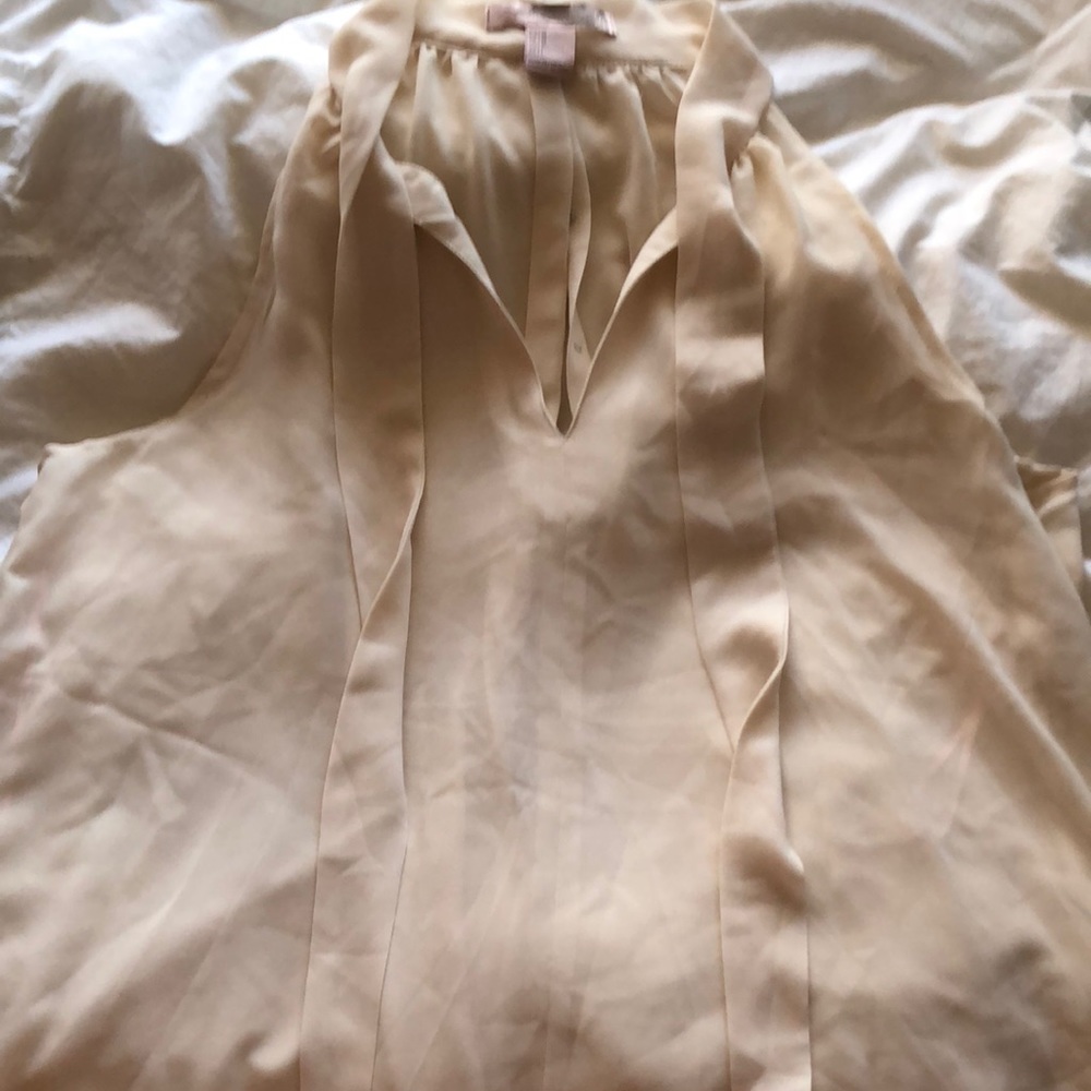 Cream colored loose fitted M size blouse