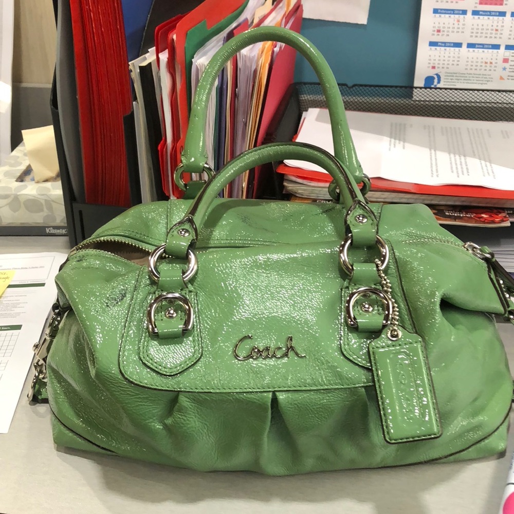 green small coach bag. Comes with duster also