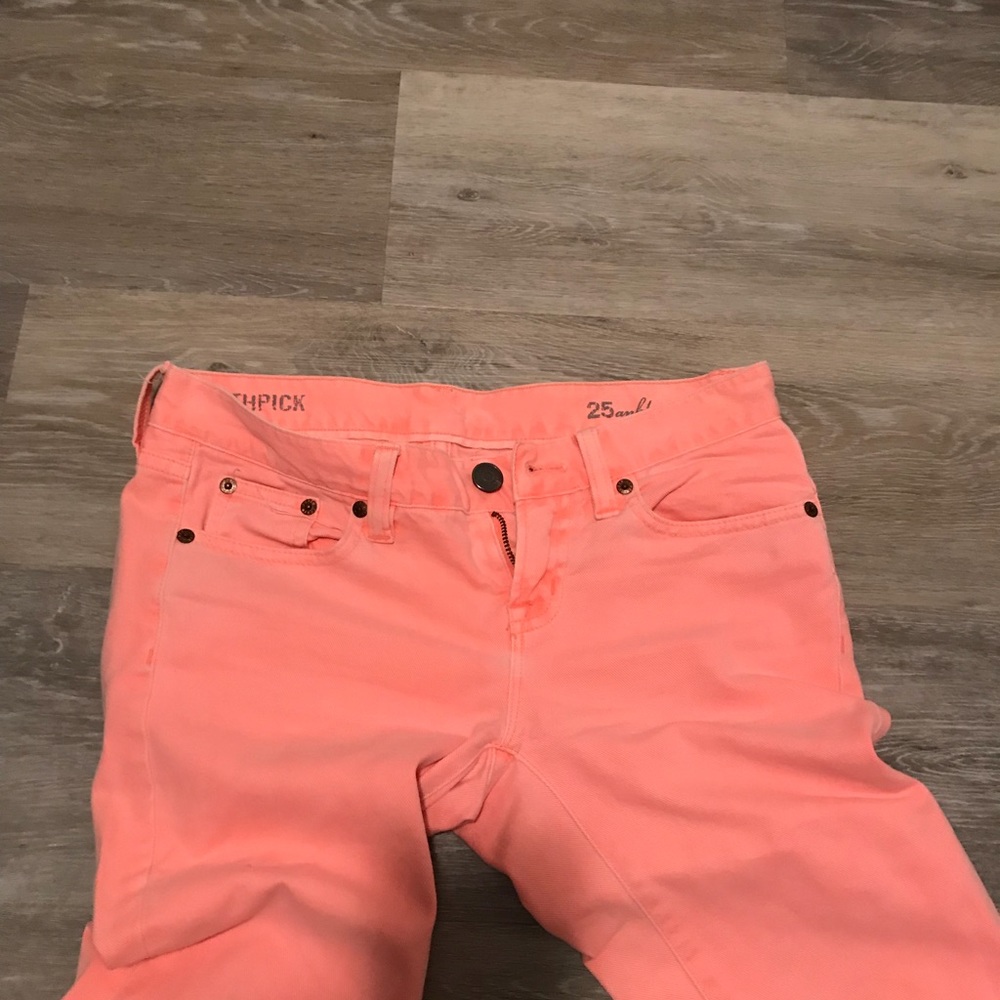 Pink J. Crew toothpick jeans.