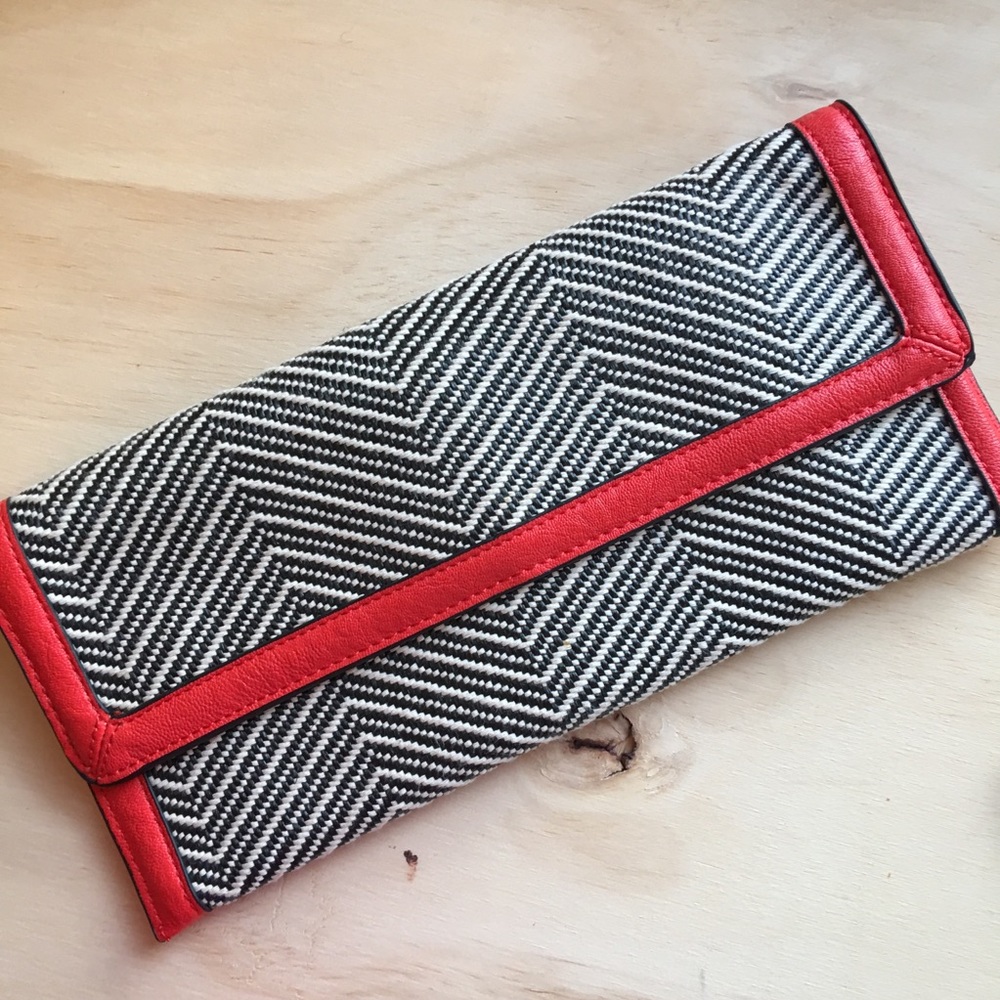 **Sold**The Limited Orange And Black Clutch