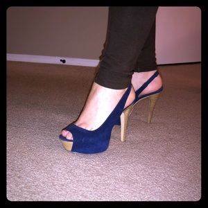 Open toe blue navy pumps.