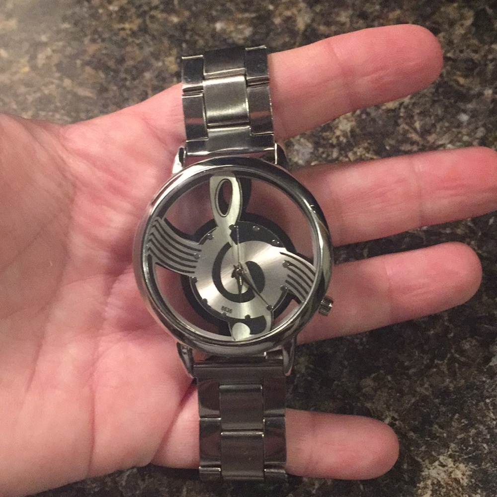 Men’s watch with treble clef 🎼 design.