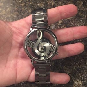 Men’s watch with treble clef 🎼 design.