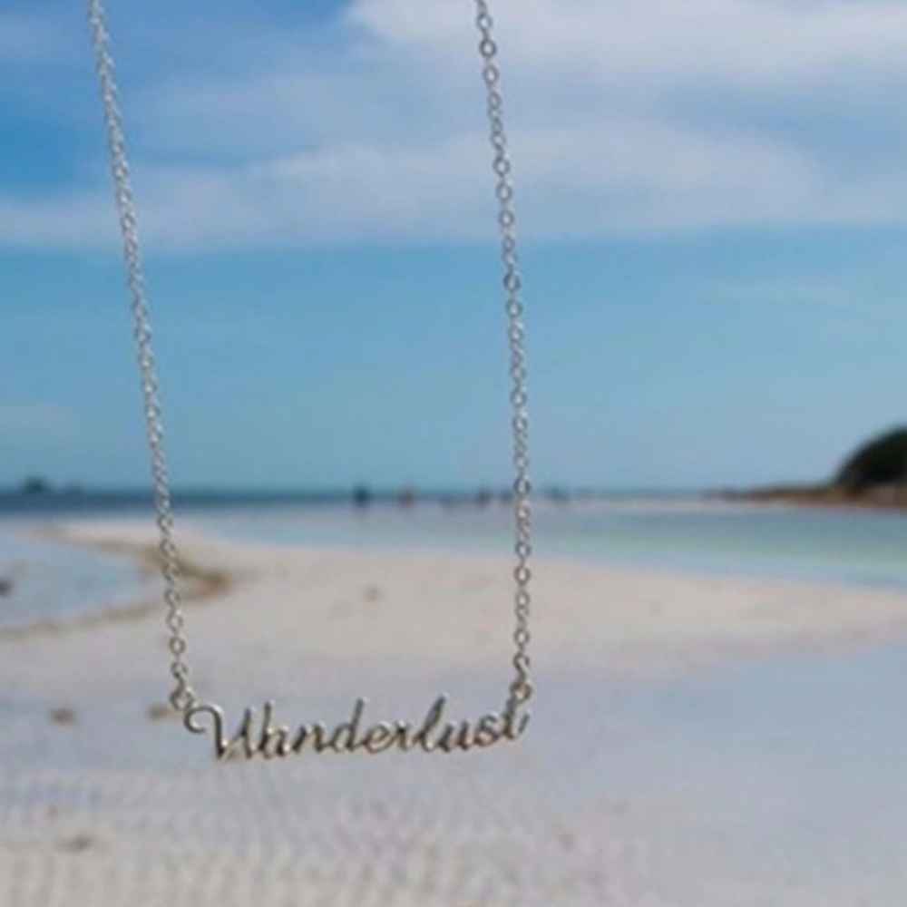 Wanderlust Gold tone necklace -- New!
