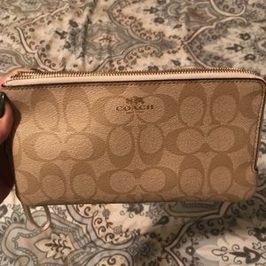 Tans and white coach wristlet