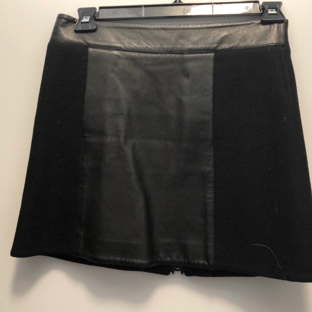 Black wool mini skirt with leather panel