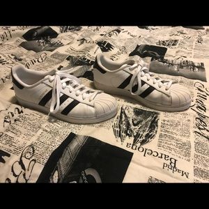 White with black adidas superstars