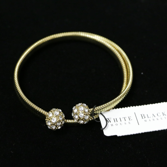 White House Black Market Jewelry - NWT gold coil bracelet with crystal ends WHBMB14