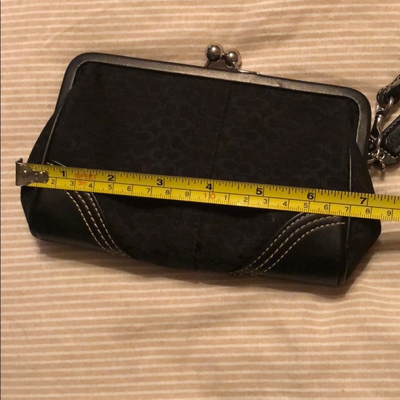 Coach black kiss lock wristlet. - Picture 1 of 6