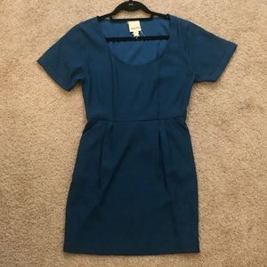 Dark teal dress with pleated waist and pockets