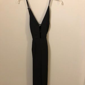 Black jumpsuit with plunge neckline