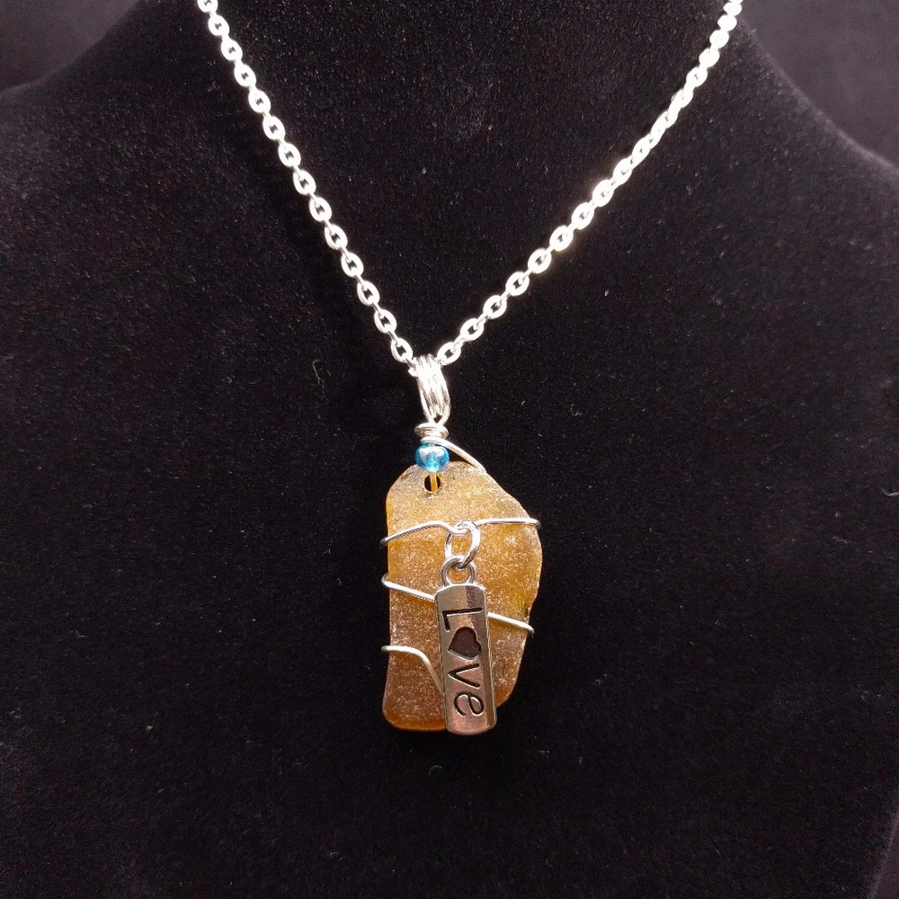 Sea glass pendant with love charm
