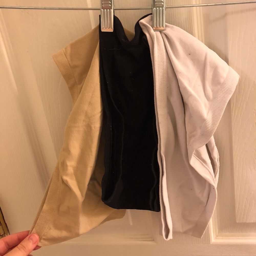 Three bandeaus - one white, one black, one nude