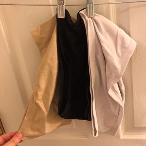 Three bandeaus - one white, one black, one nude