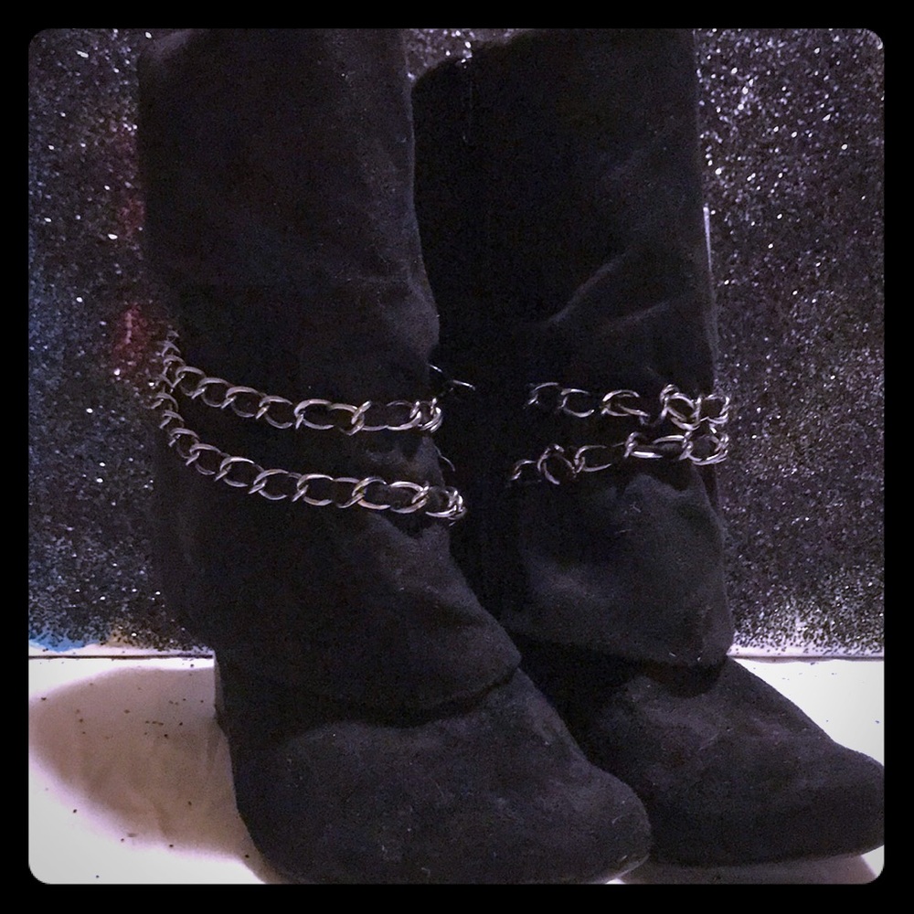 Black suede folder over wedges with chains...