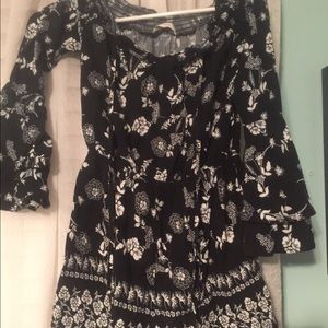 Black romper with white flowers size small