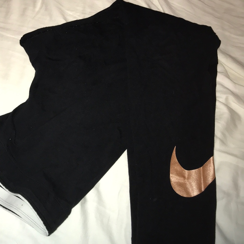Black Nike leggings with gold check