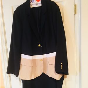 Black, tan, and white color block suit