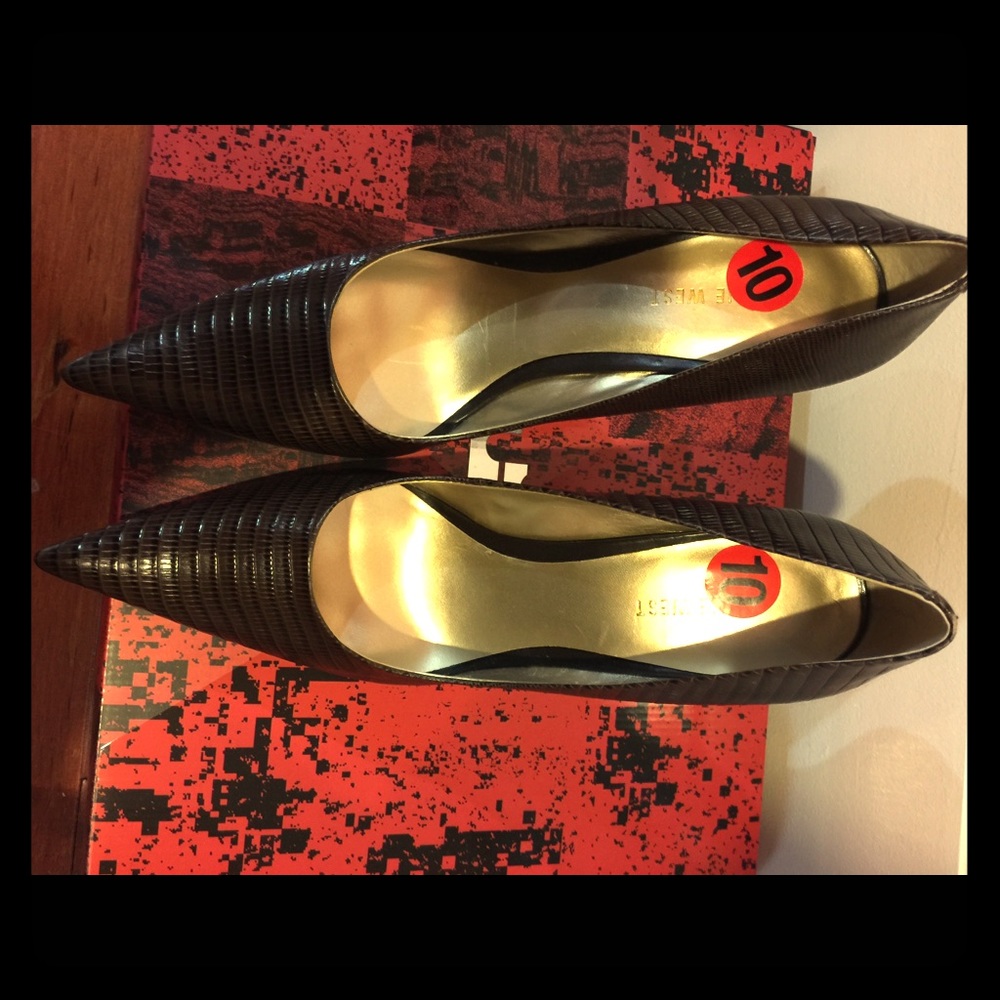 Brown pointy toe heels.