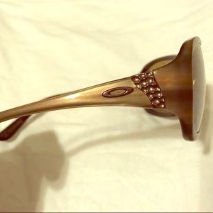 Women’s Oakleys. Brown frames with embellishments.