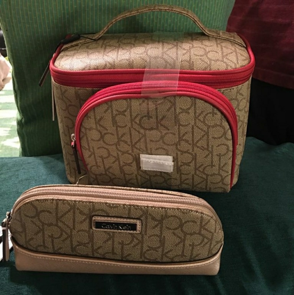 Calvin Klein  vanity case and two pouchs