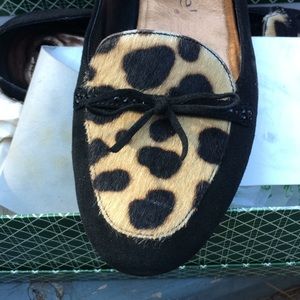 Black suede flats with Pony hair trim.