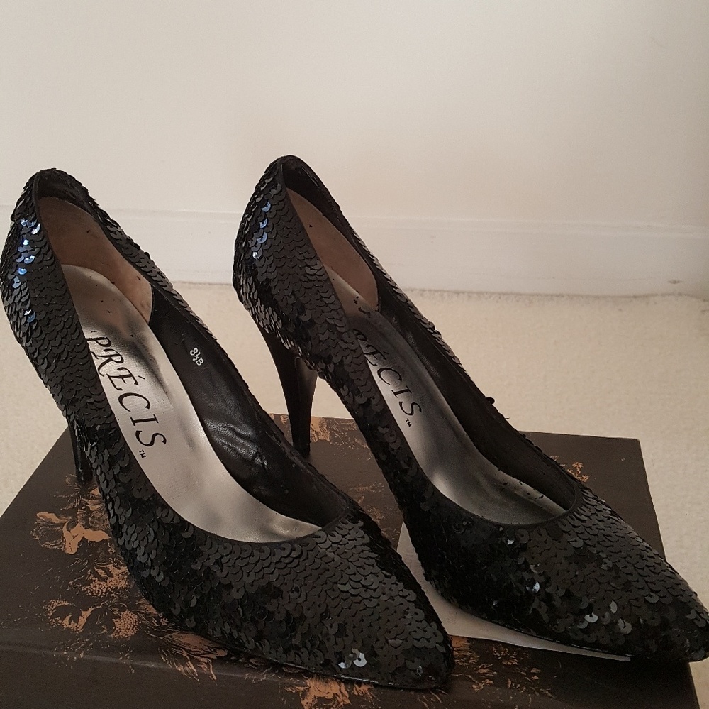 Black sequin pumps