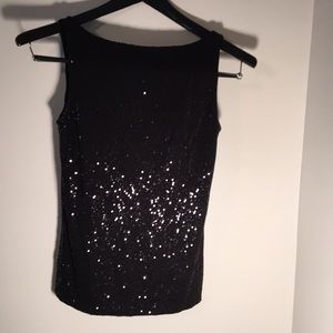 Sequin, black top.