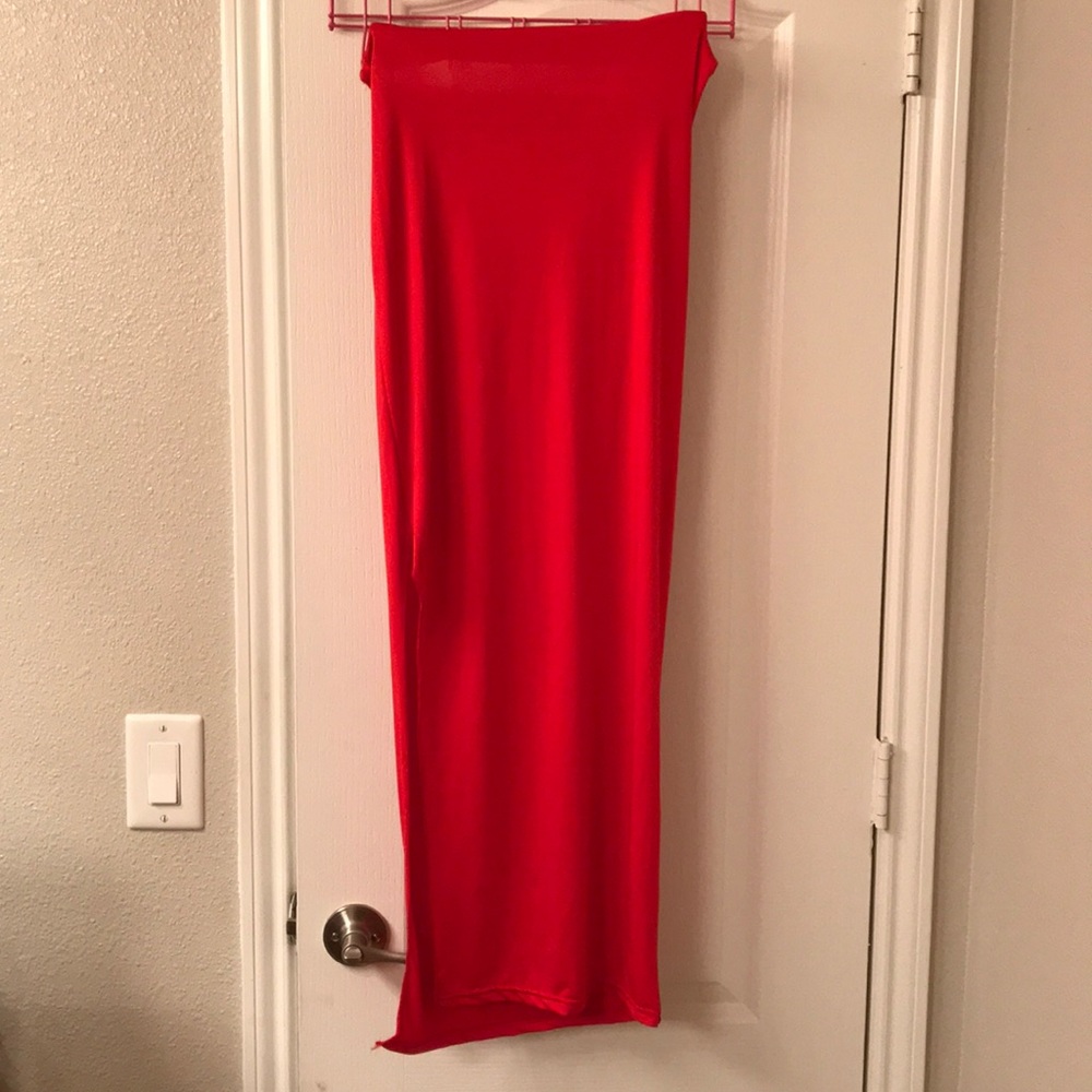 Form fitting red skirt with split