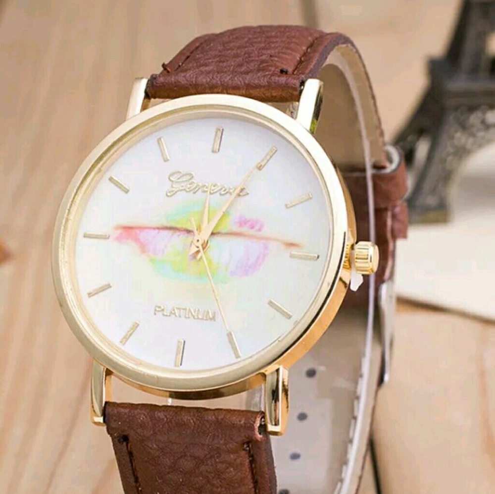 Watch. Lg White face with pastel design in middle