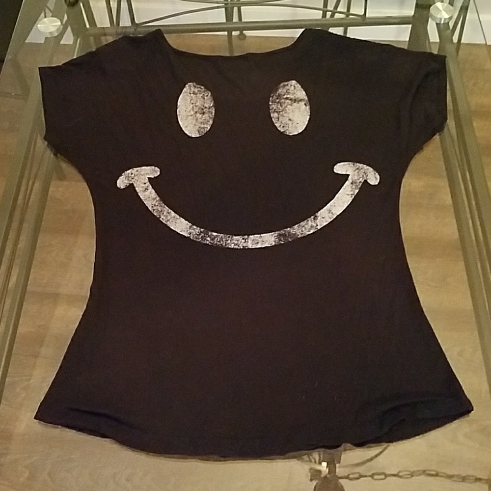 Be smiley face black and white shirt.