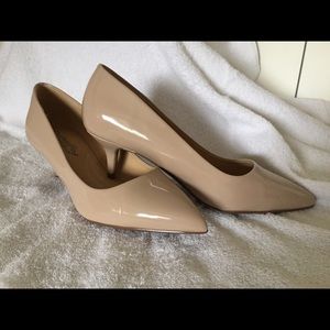 Nude kitten heel pumps.