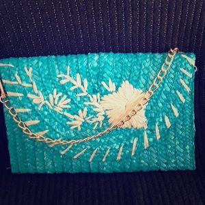 Turquoise straw clutch