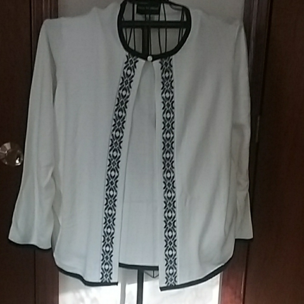 Ivory sweater with black trim