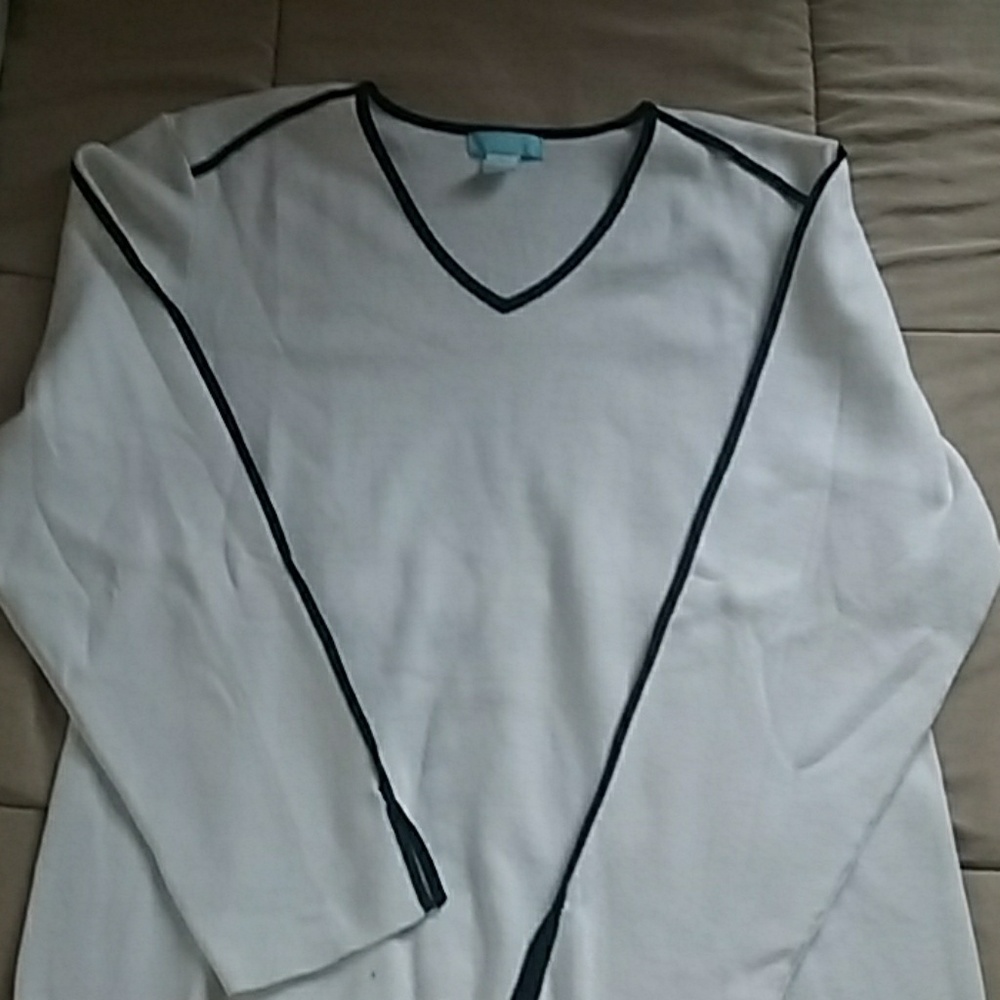 White sweater with black accent stripes