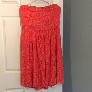Coral sleeveless Eva Mendes dress