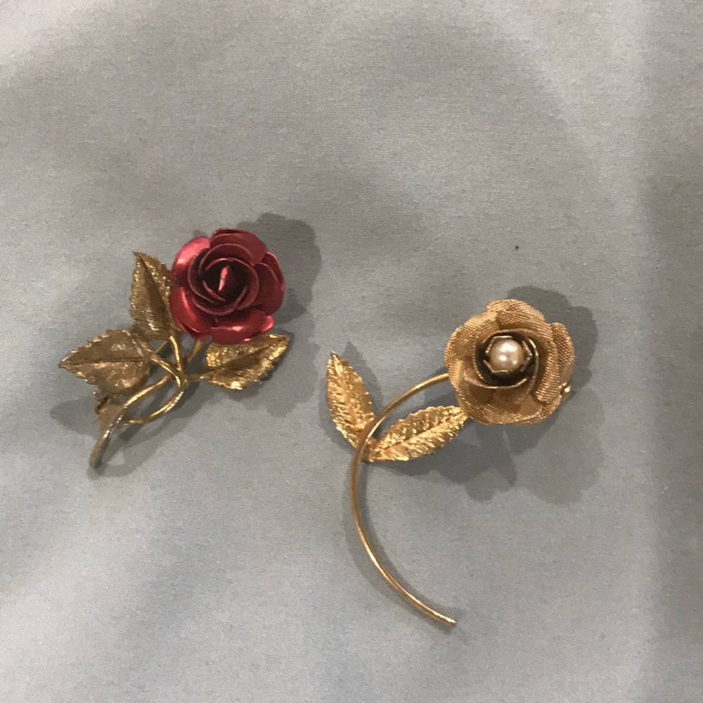 Two Rose brooches