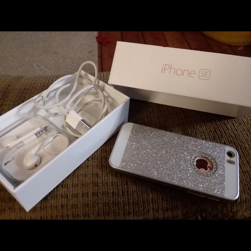 iPhone SE in Rose Gold with a silver case.